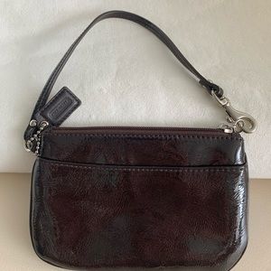 Coach zip wristlet w/card & tissue pocket.